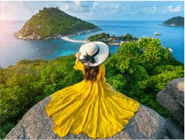 Woman enjoying tropical island view organized by the best travel agency in Delhi