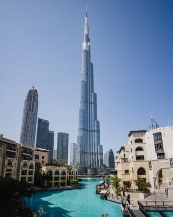 View of Burj Khalifa and modern skyline in Dubai with luxury buildings and canal – Fab Holidays, best travel agency in Delhi